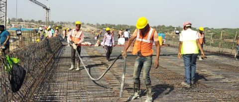 Workers on reinforcement mesh
